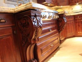 Large carved corbels surrounding cook top with drawers