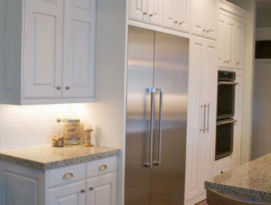 White kitchen with stainless appliances
