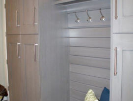 Gray mud room lockers including bench seating with drawers below