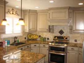 White kitchen cabinets with a great hood