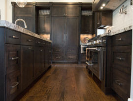 All wood kitchen with appliance panels on fridge