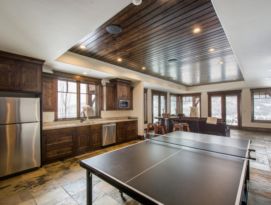 Game room kitchenette with ping pong table