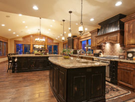 Expansive kitchen with wood and distressed black cabinetry