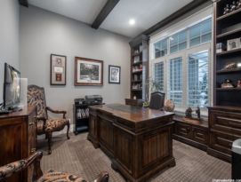 Home office with built in window bench and book cases