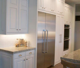 White kitchen with stainless appliances