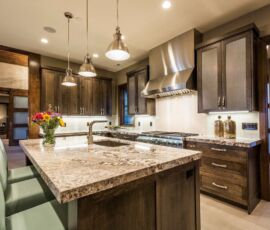 Gray kitchen with stainless hood