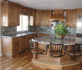 Natural wood kitchen with round island
