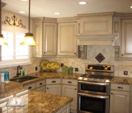 White kitchen cabinets with a great hood