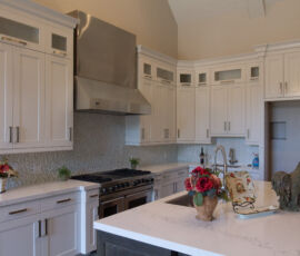 White kitchen with stainless appliances