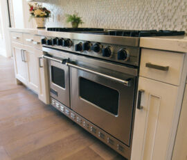 White kitchen with stainless appliances