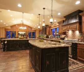 Expansive kitchen with wood and distressed black cabinetry