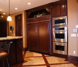 Wood fridge panels blend in with the kitchen cabinetry