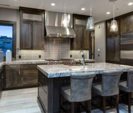 Gray quarter sawn oak kitchen cabinetry with granite counter tops