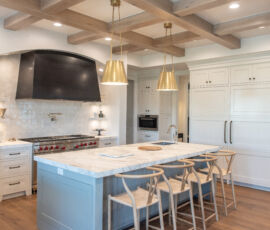 White and gray kitchen with neutral woods.