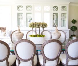 White hutch with elegant seating around glass top table