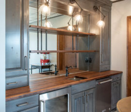 Wet bar with gray cabinetry